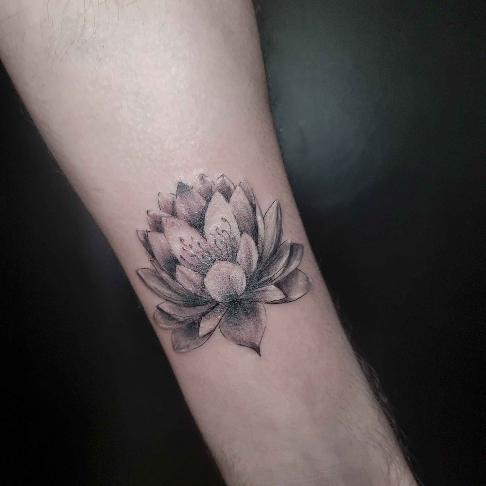 LOTUS — WRIST tattoo — black & grey, wrist — by Kayleigh Chaos, tattoo artist in Perth, Scotland