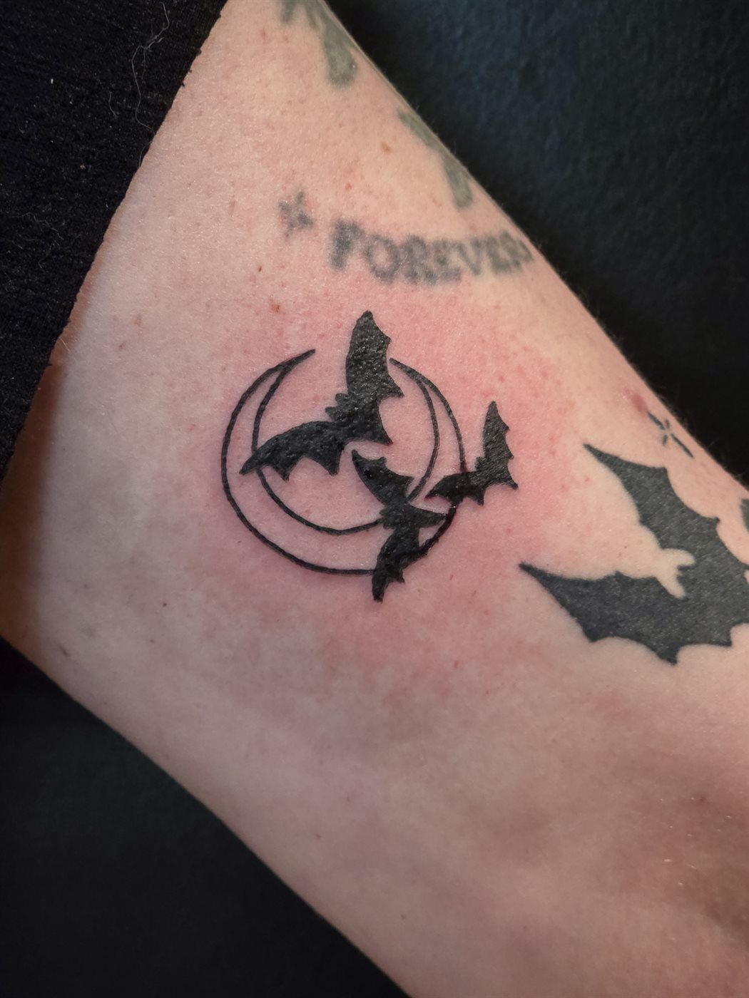BATS + MOON tattoo — blackwork, forearm — by Kayleigh Chaos, tattoo artist in Perth, Scotland