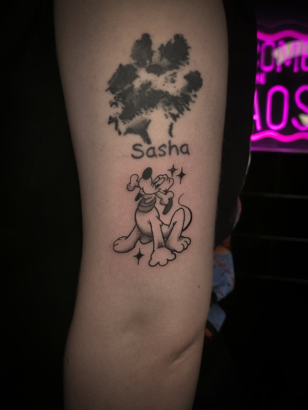 PLUTO tattoo — cartoon, arm — by Kayleigh Chaos, tattoo artist in Perth, Scotland