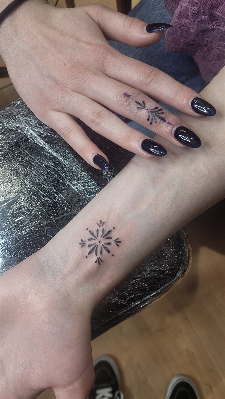 SNOWFLAKE tattoo — fine line, wrist — by Kayleigh Chaos, tattoo artist in Perth, Scotland