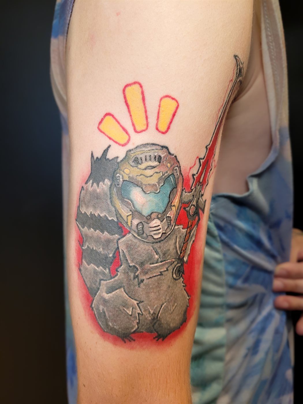 DOOM SLAYER + RACCOON tattoo — gaming, upper arm — by Kayleigh Chaos, tattoo artist in Perth, Scotland