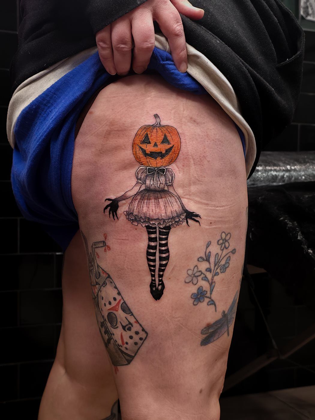 PUMPKIN DOLL — THIGH tattoo — horror, thigh — by Kayleigh Chaos, tattoo artist in Perth, Scotland
