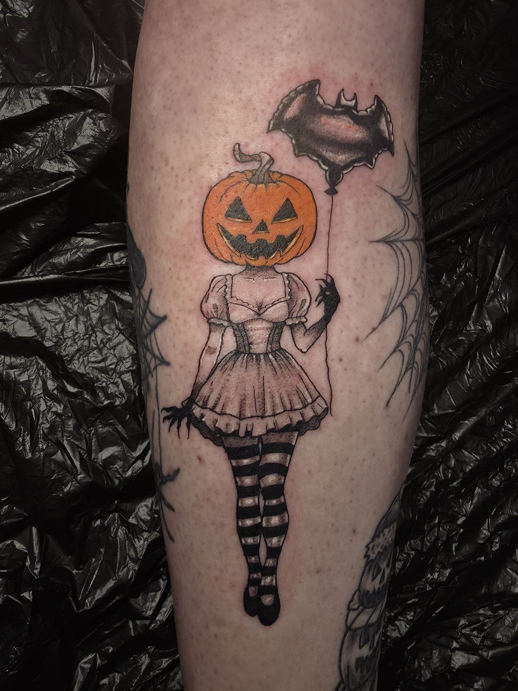 PUMPKIN DOLL — LEG tattoo — horror, leg — by Kayleigh Chaos, tattoo artist in Perth, Scotland