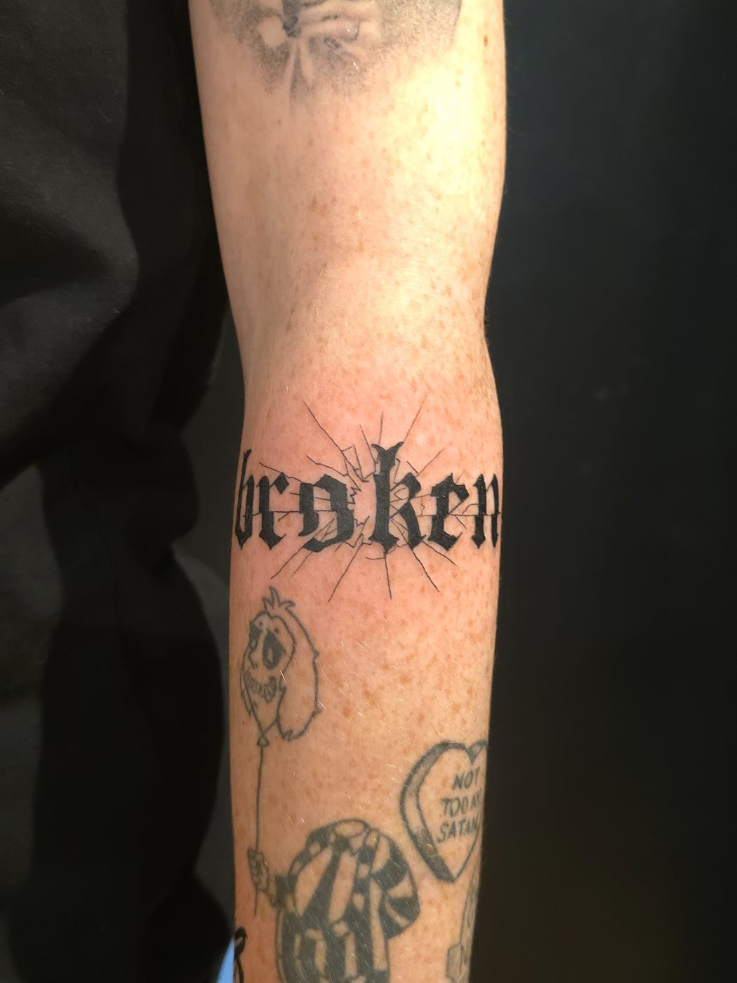 BROKEN tattoo — script, forearm — by Kayleigh Chaos, tattoo artist in Perth, Scotland
