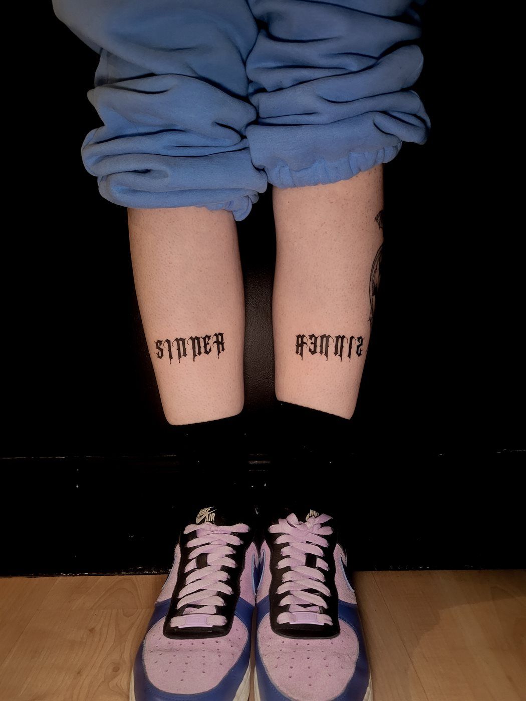 SINNER ×2 tattoo — script, both shins — by Kayleigh Chaos, tattoo artist in Perth, Scotland